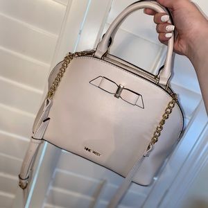 Nine West crossbody with bow accent.